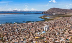 Peruvian city Puno and lake Titicaca panorama, Peru
